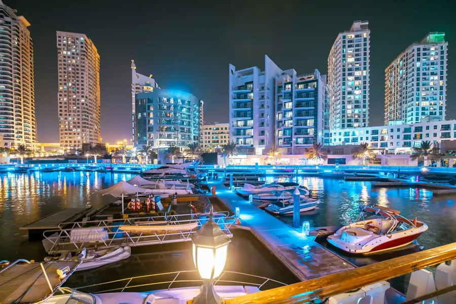 Dubai Marina with yachts in the water and glass towers behind