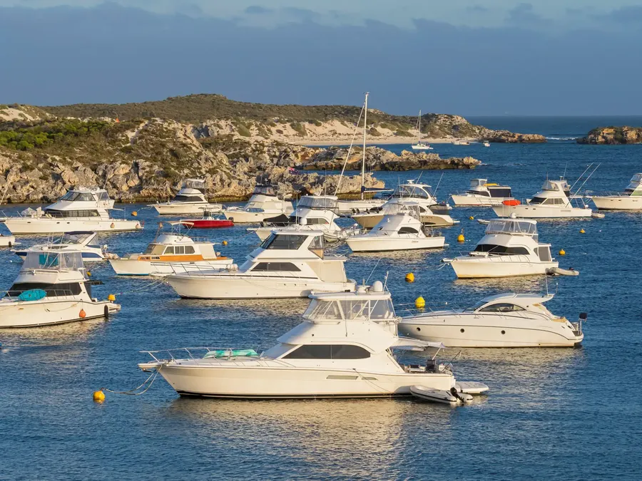 Geordie Bay on Rottnest Island with boats moored in turquoise water